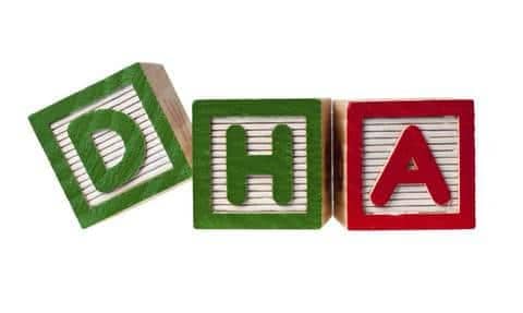 Wooden blocks forming the letters DHA isolated on white background